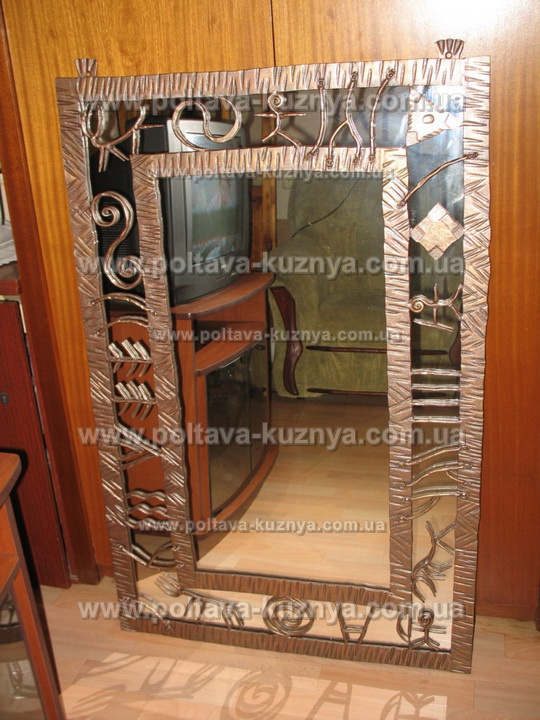 Forged frame for a mirror