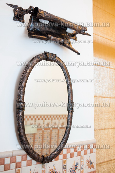 Forged frame for a mirror